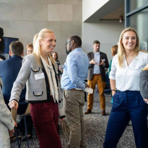 Students and employers chatting.